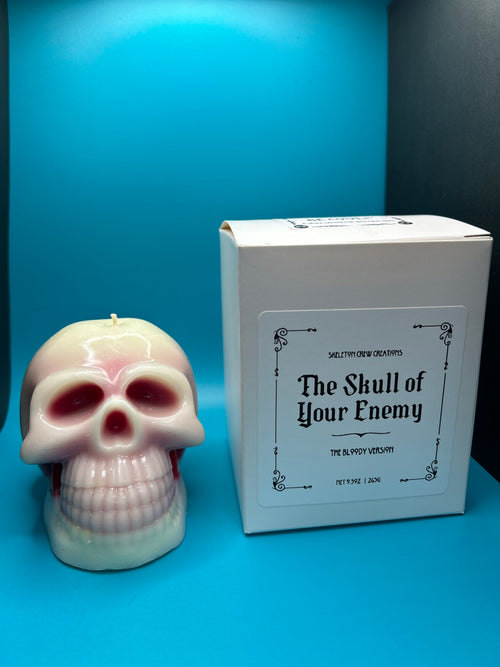 Skull-shaped product with a box labeled 'The Skull of Your Enemy' on a blue background