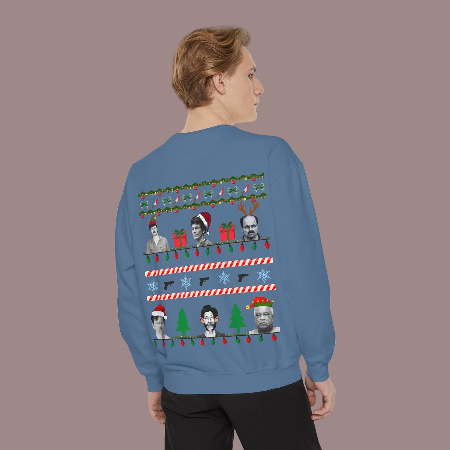 Person wearing a blue sweater with Christmas-themed designs on the back