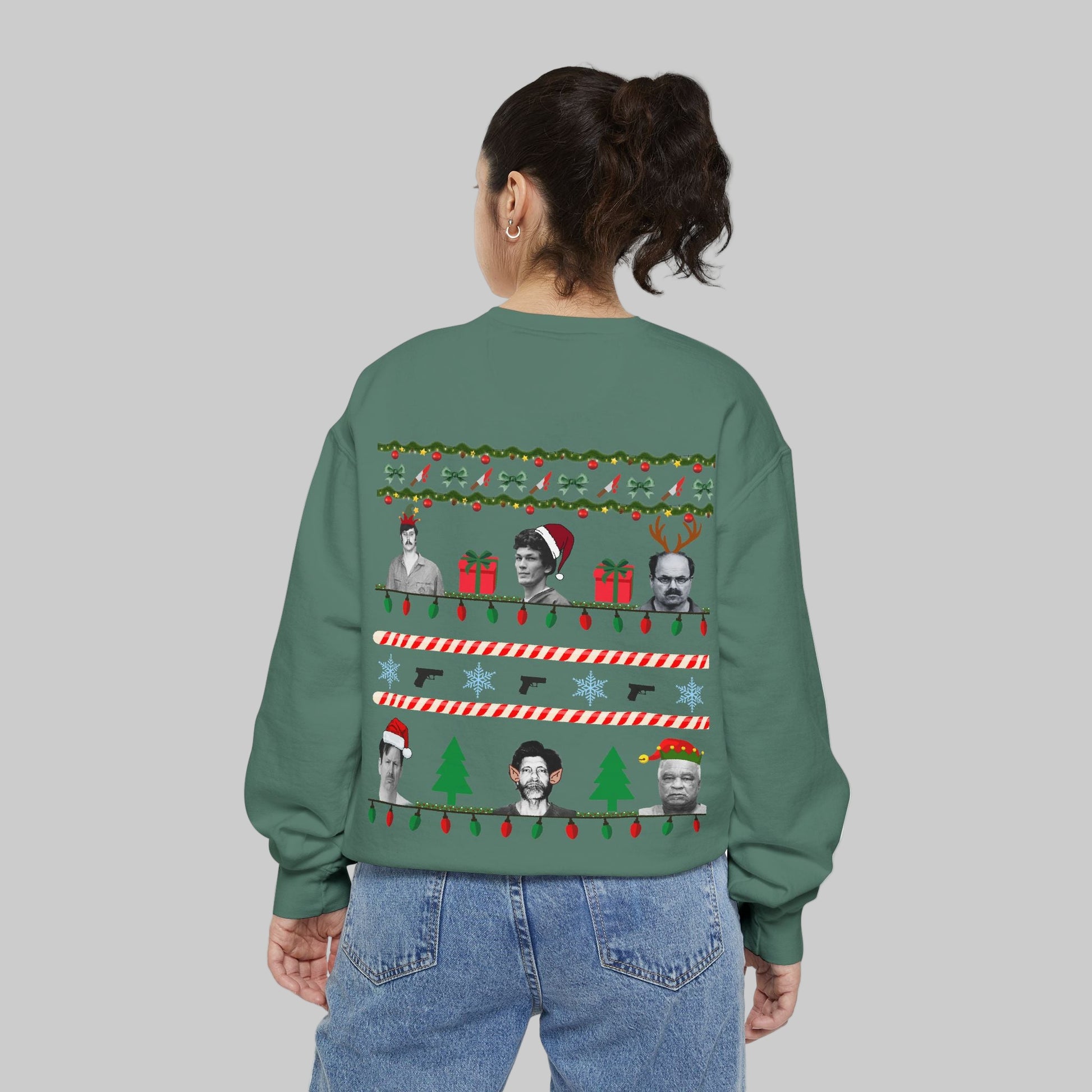 Person wearing a green sweater with Christmas-themed designs on the back