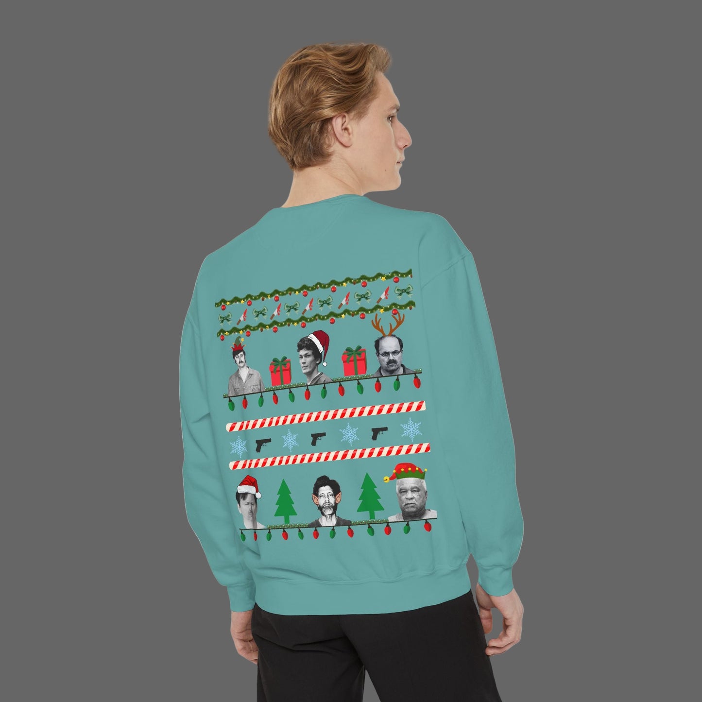 Person wearing a teal Christmas sweater with festive designs on a white background